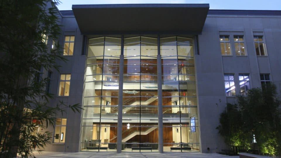 Hough Hall curtain wall at twilight and lights on inside