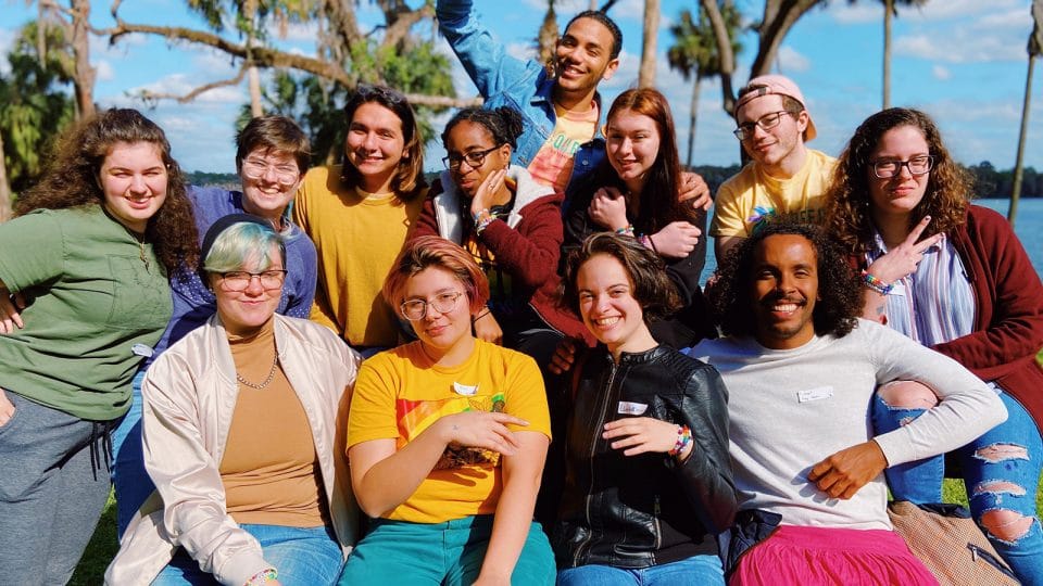 Group of students sitting together and smiling