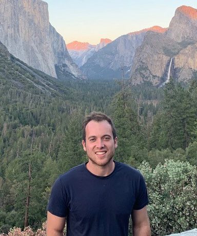 Jonah Platovsky hiking in the mountains