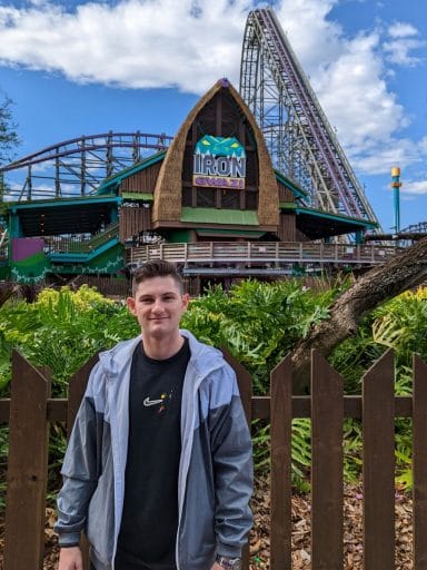 Johnathan McCary with the Iron Gwazi roller coaster in the background