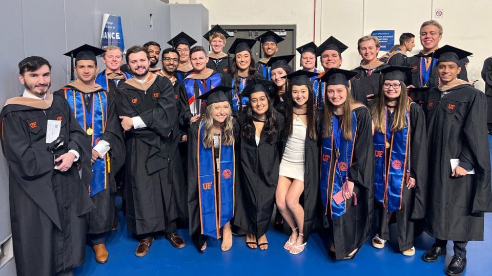 MSF class gathers for a group photo at graduation