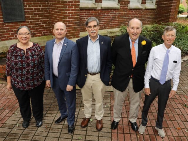 Bruce Foerster stands with panel members Geoffrey H. Doughty, Jim Mathews and Ruth Steiner, and moderator Jay R. Ritter