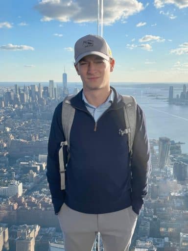 Jonas Gaspari high up in a building with New York City in the background