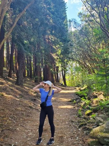 Michelle Cuppy hikes in the woods