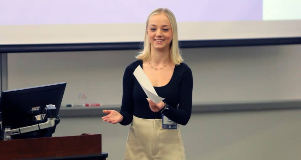 A student at the front of the classroom