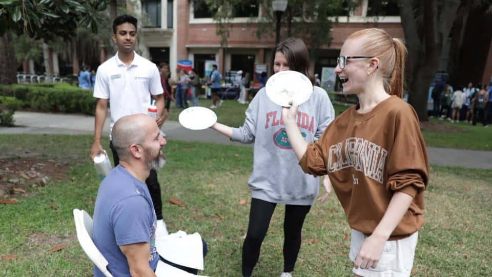 Students ready to put a pie in a willing faculty member's face at a Halloween Bash and Spring Bash event