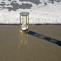 Hourglass on beach