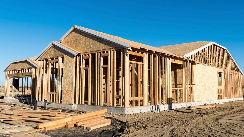 New home framed up on a construction site