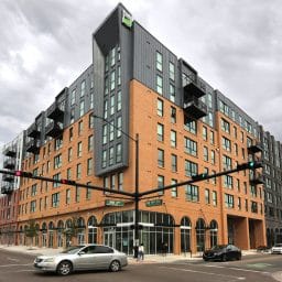 Building with retail shops on the ground floor with apartments above them