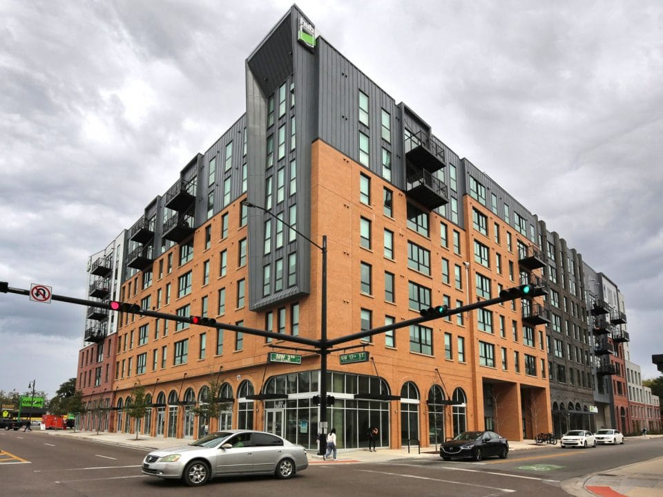 Building with retail shops on the ground floor with apartments above them