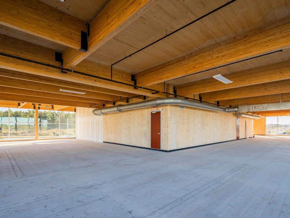 Inside a new construction project using a lot of wood for floors, ceilings and walls