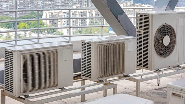 Heating and cooling units on top of a building in New York City.