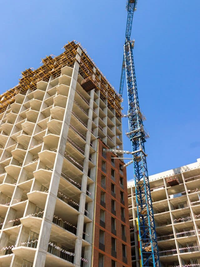 A new apartment being built with a crane next to it