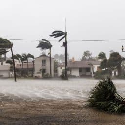 Coastal homes during a hurricane endure winds and storm surge