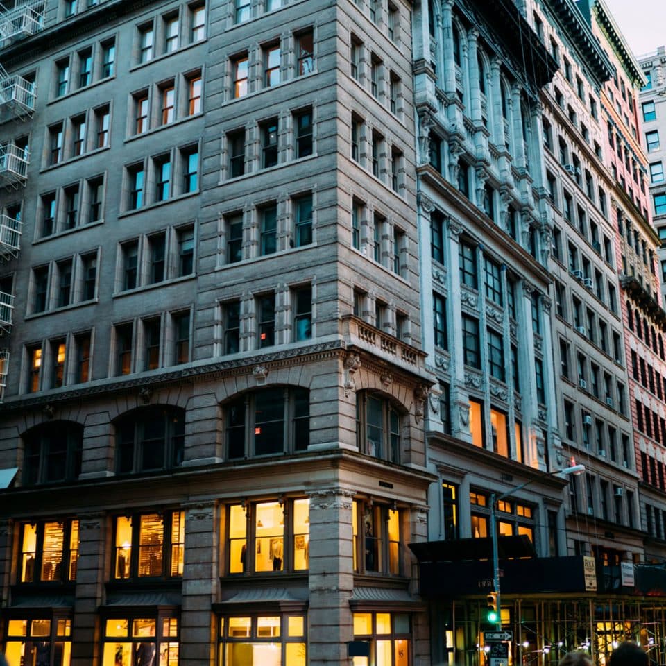 An older commercial building several stories tall in a downtown area