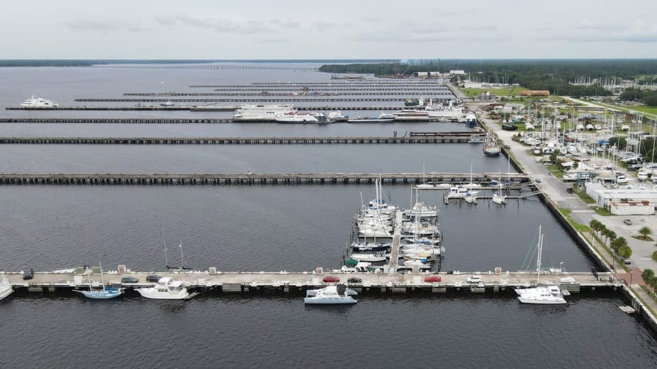 Aerial photo of Clay County Marina with several boats docked and overcast skies