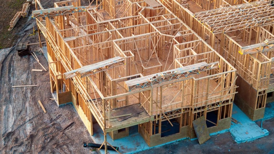 Aerial view of affordable housing construction with the units mostly framed in