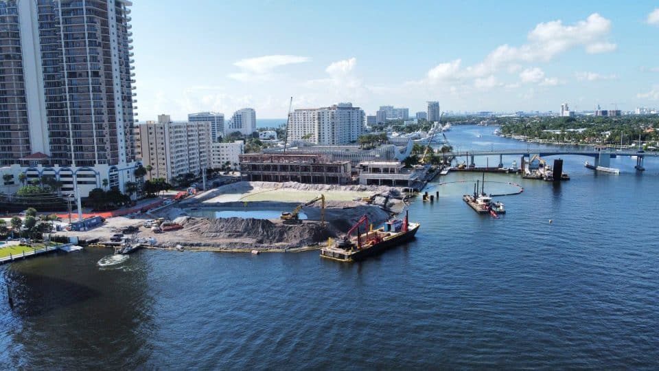 Las Olas Marina under renovation with heavy equipment and boats at work