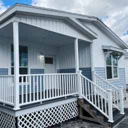 Model mobile home with a covered porch