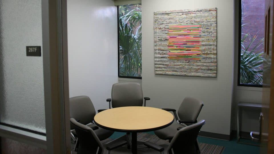 A room with a small round table and chairs