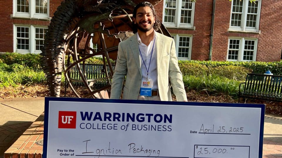 2025 Big Idea Competition winner: Ignition Packaging's Abdurrahman Bejjaj holds a check for ,000