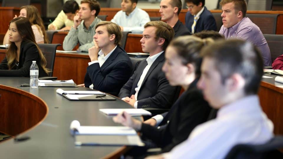 Students listen to a lecture in a classroom