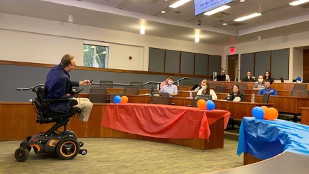 Students in a classroom listen to a presenter at the event, The Last Frontier: Incorporating Disability Into D&I