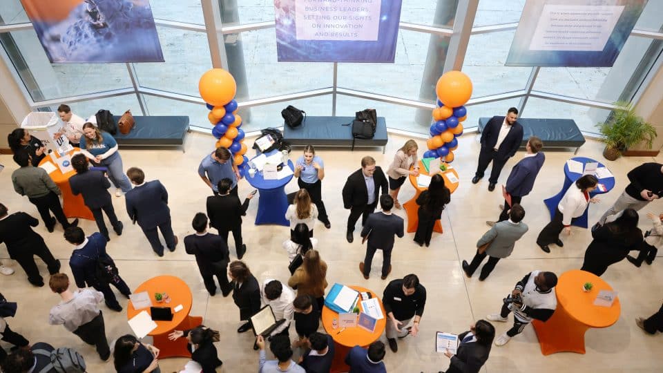 View from above of students networking at an event in Hough Hall