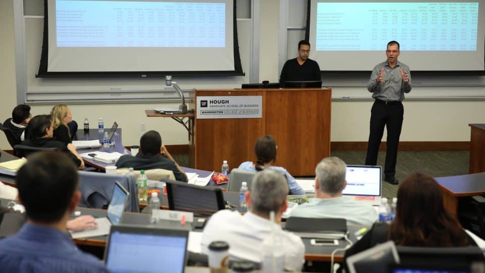 A student addresses others in a Hough Hall classroom