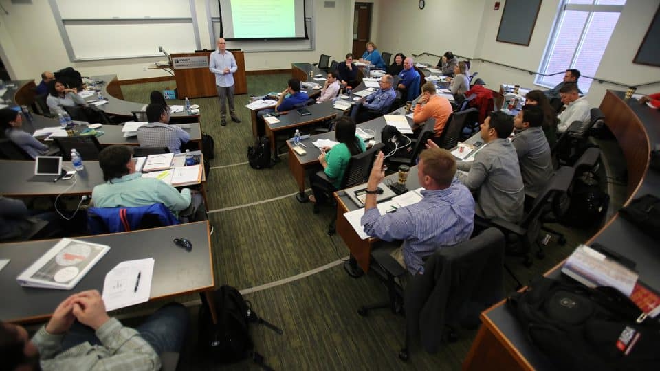 Amir Erez having discussions with students in a Hough Hall classroom