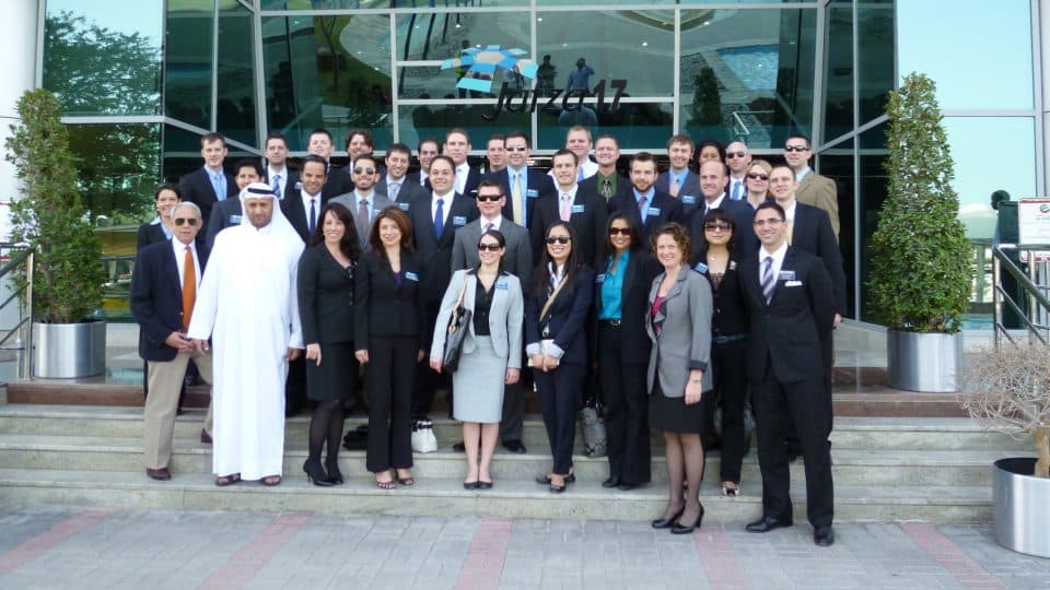 A group including Warrington College of Business representatives stand outside DP World