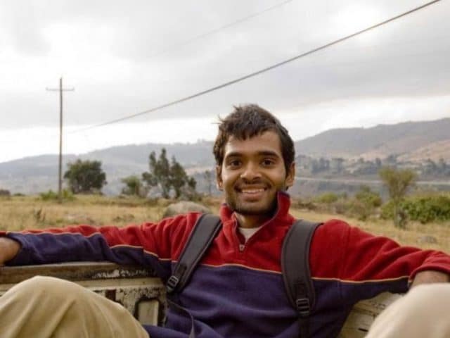 Abhi Lokesh riding in the back of a pickup