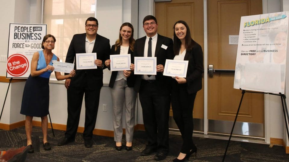 UF Business for Good Lab: Sustainable Business Consulting for B Corp certification with Kristin Joys presenting award to Sustainable Breakthroughs team, founded by Gator Grad, Grant Kendzior in Spring 2019