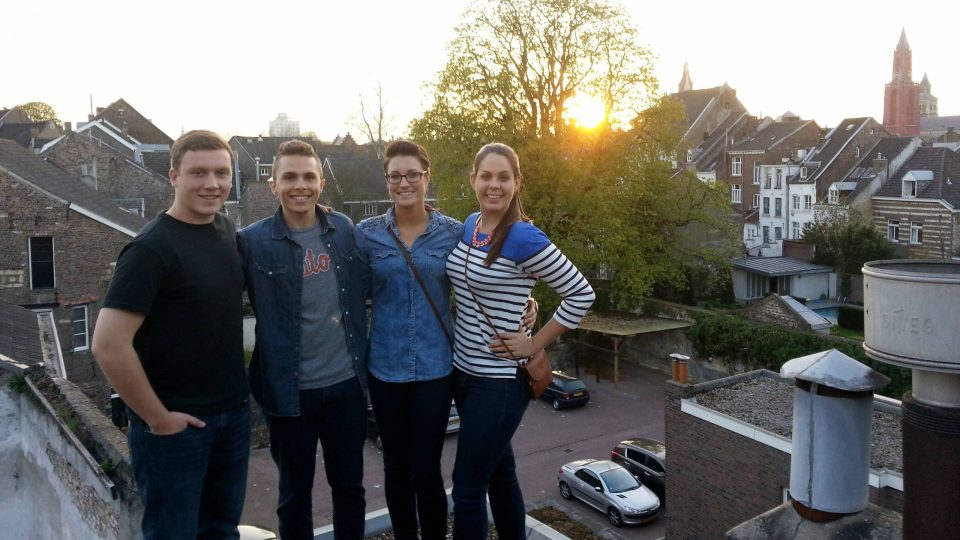 Students on a rooftop at sunset in Maastricht