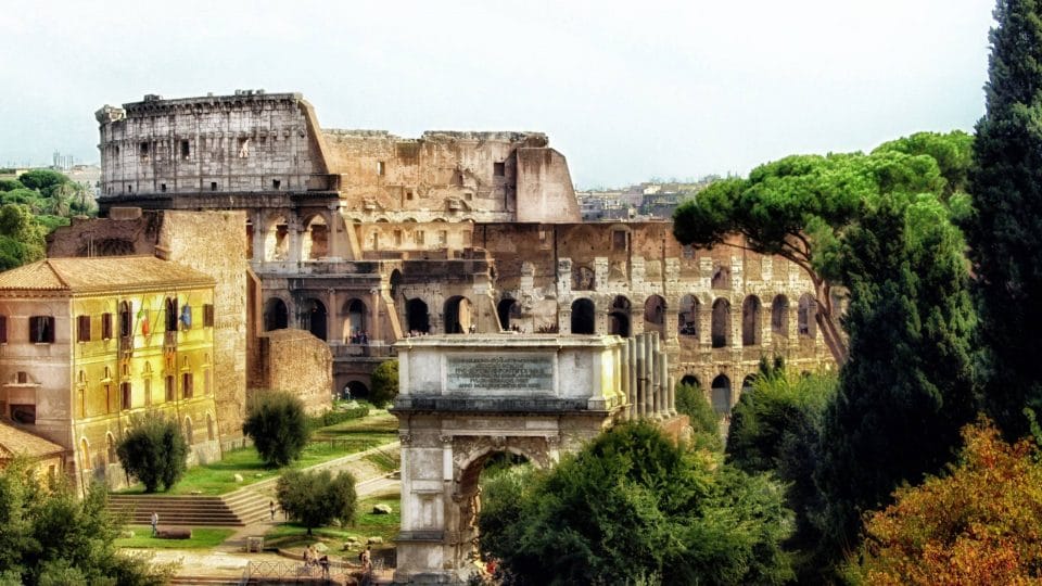 Ruins with the Colosseum in the background in Rome, Italy