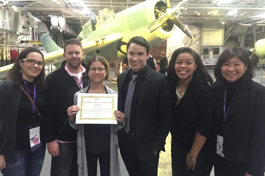 Susana Santos, Jamie Kraft, Kristin Joos (holding the award certificate), James Parenteau, Synclair Henry and Nola Miyasaki