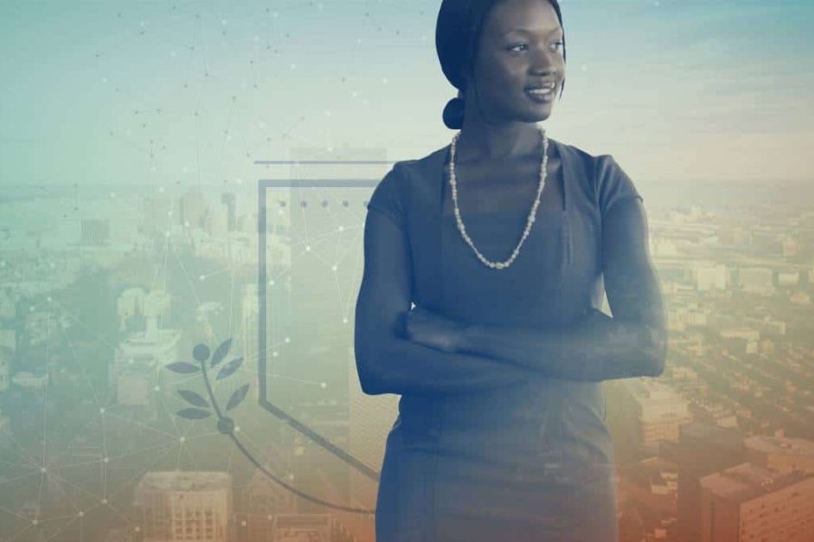 Faded orange and blue tinted image of a professional woman looking proud