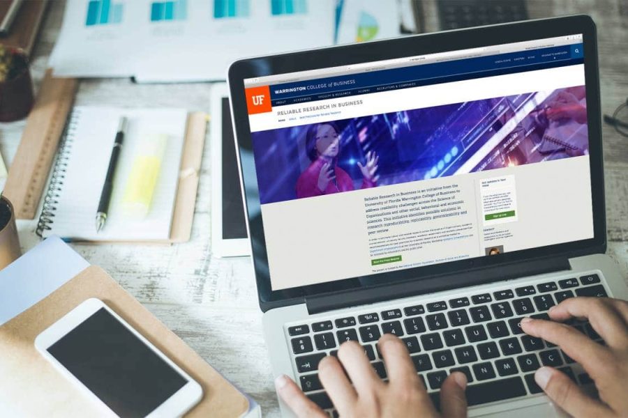 Laptop with Reliable Research in Business website displayed