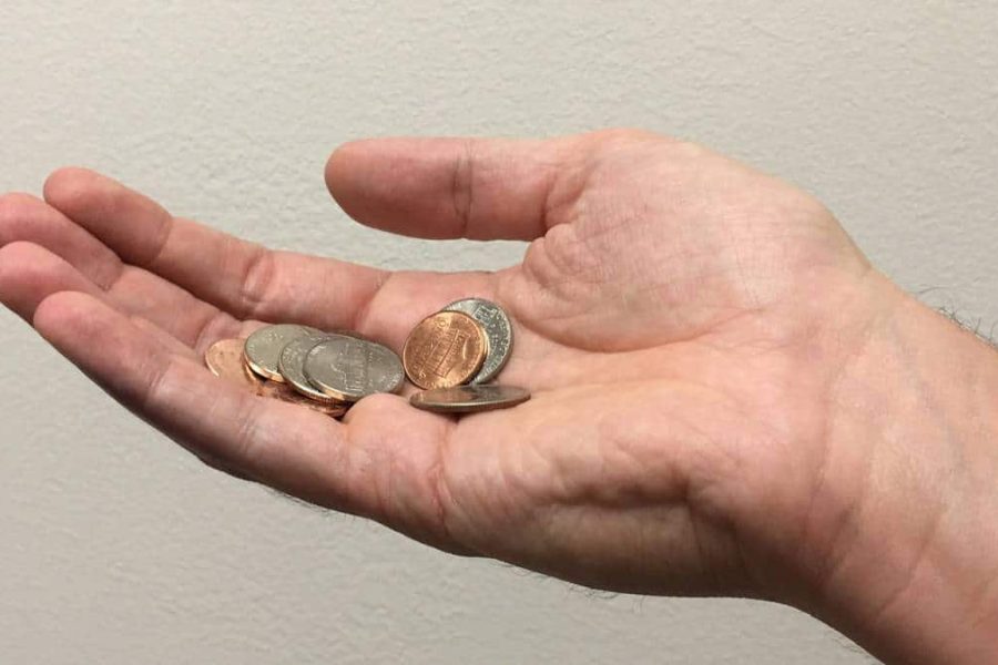Hand holding change
