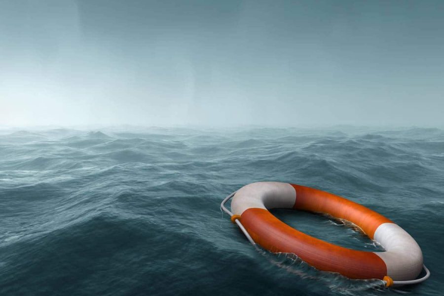 Lifebuoy floating in the vast expanse of sea