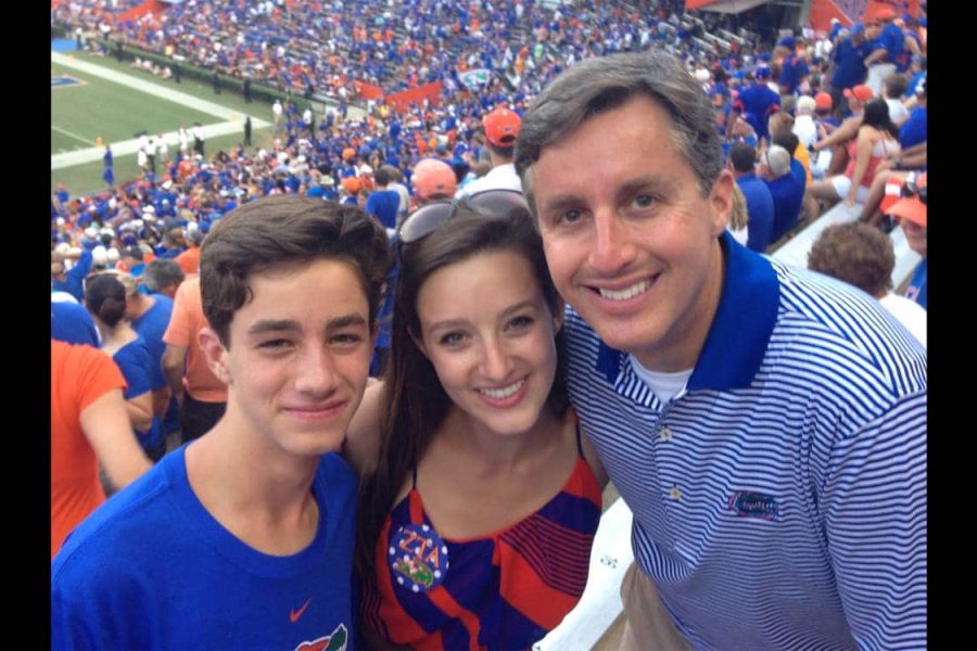 Bruce Brandes with his daughter and son at a GatorFootball game