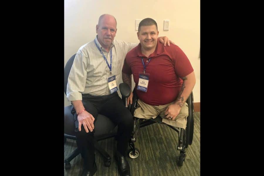 Art Jacobs with a VEP participant in a wheel chair