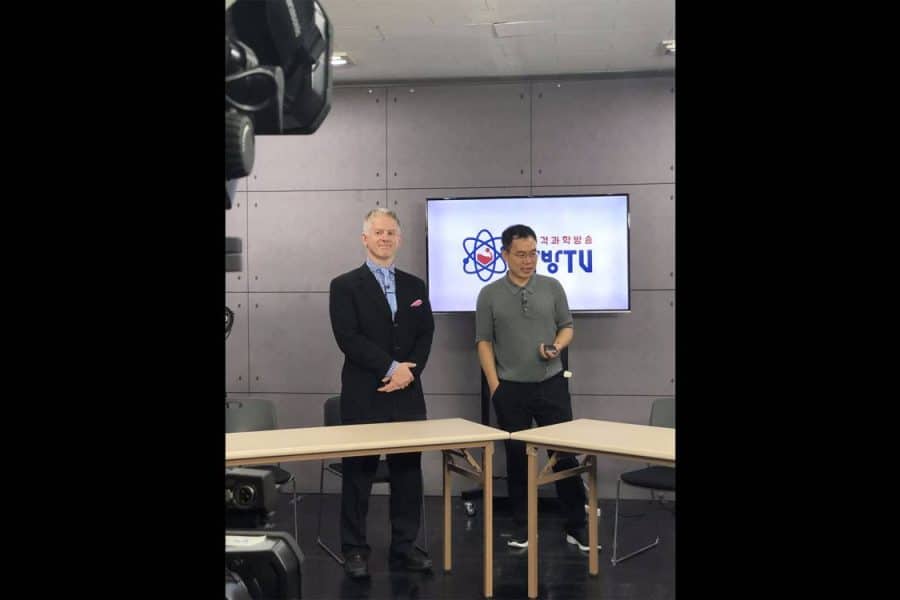 David Ross stands with AfreecaTV founder and CEO Kevin Seo on Kevin's live broadcast focused on science