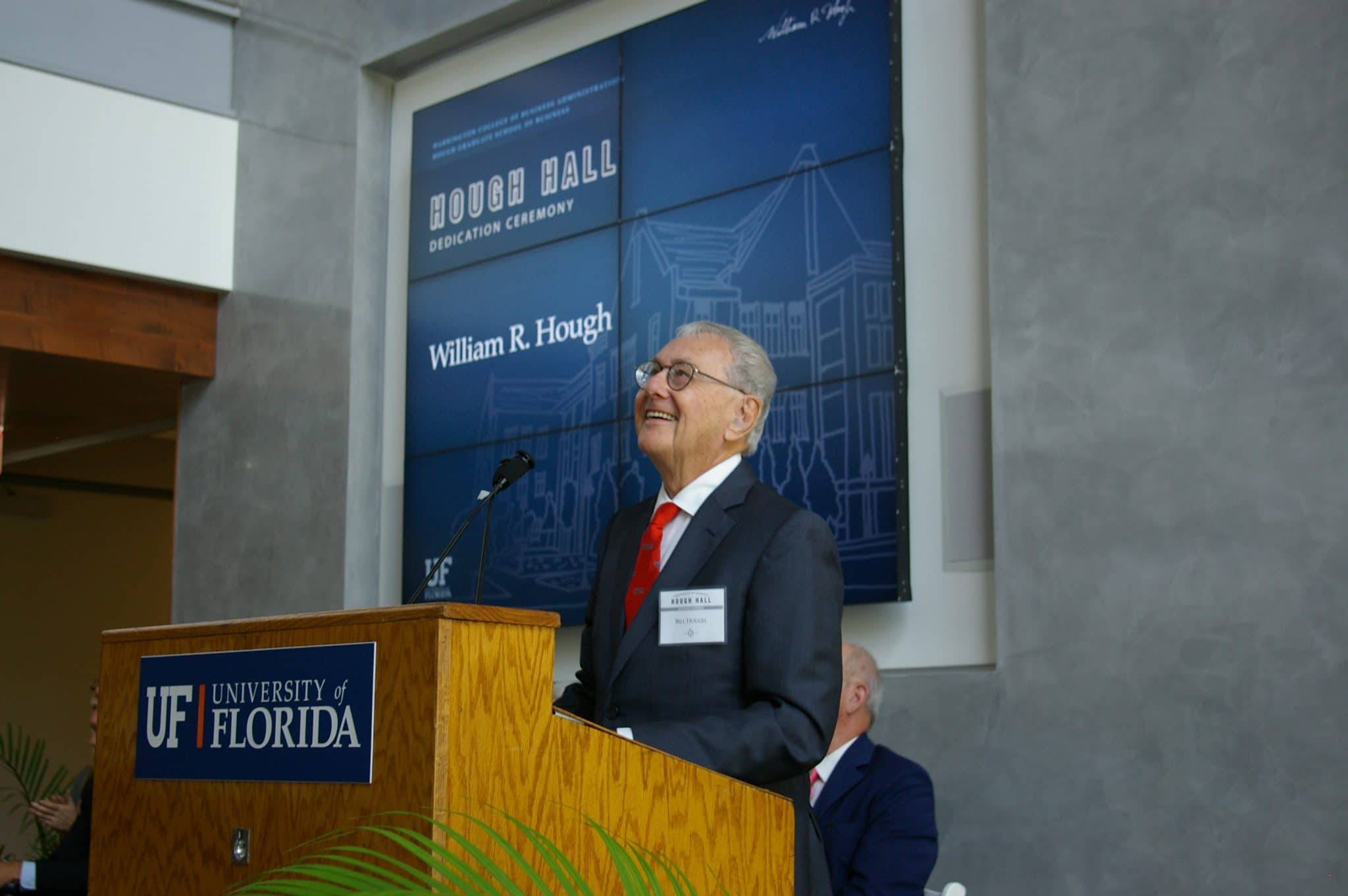 Bill Hough smiles while looking up at the crowd during the Hough Hall dedication ceremony.