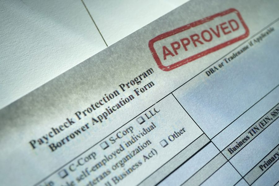 An paycheck protection program borrower application form stamped with Approved