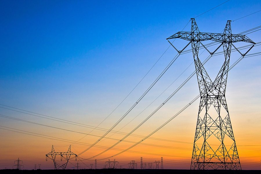 Large power network against an orange and blue sky