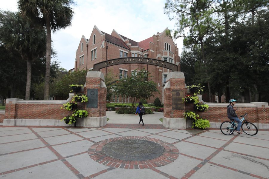 University of Florida archway with Heavener Hall in the background.