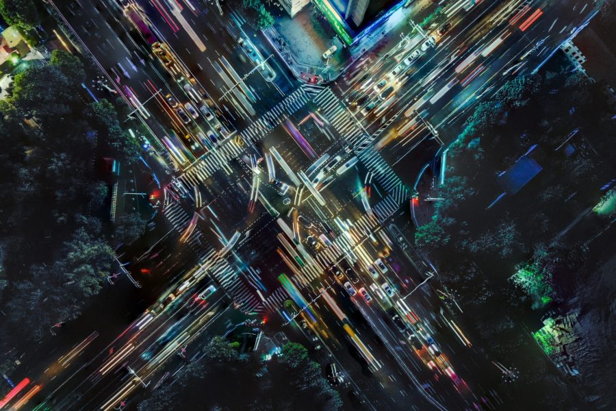 Graphic of drone point of view of city street crossing at rush hour