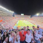 Students pose in the Florida football stadium.