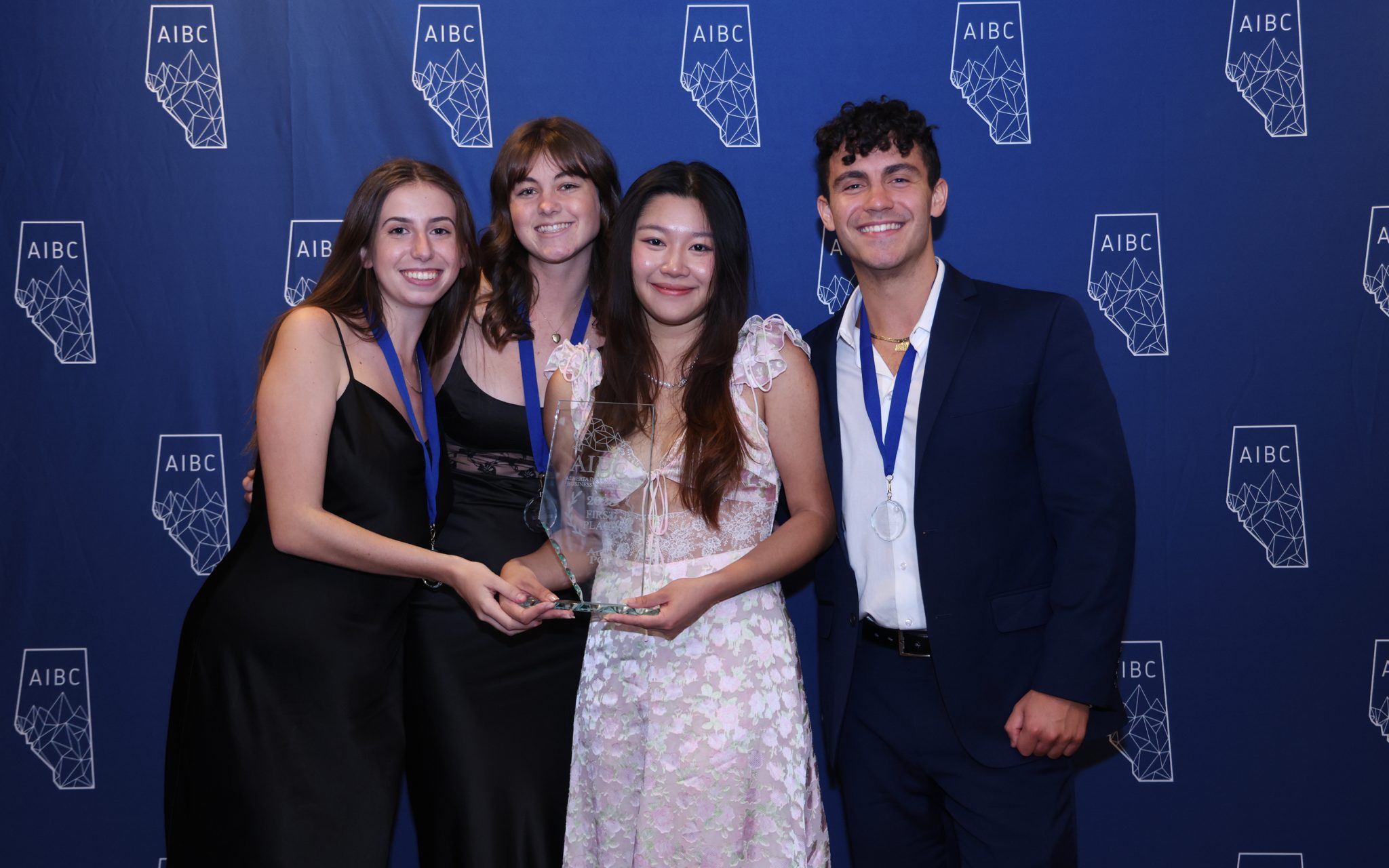 Team of students pose with award.